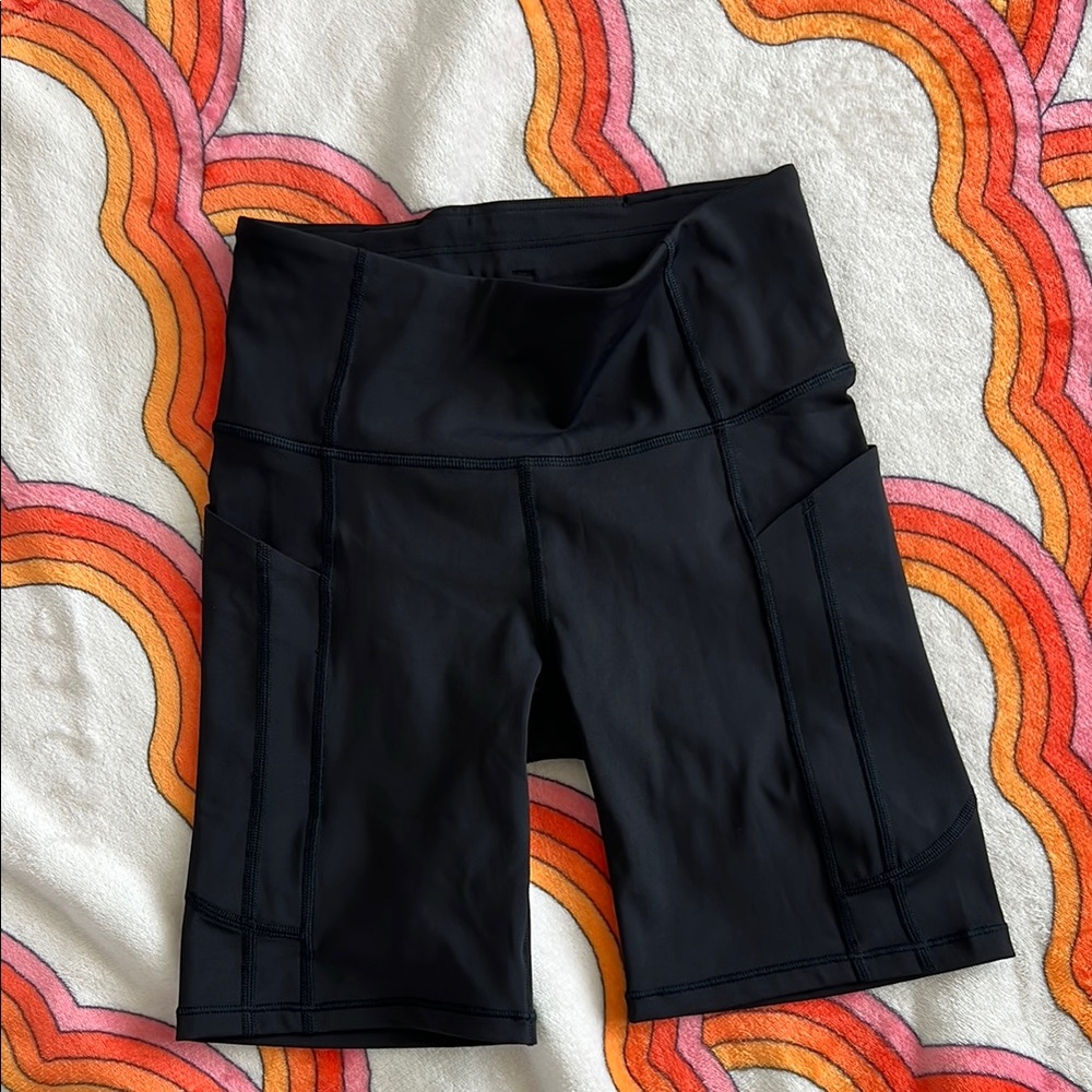 Black Athleta Performance Ultimate Stash Shorts with High Waist 7” inseam